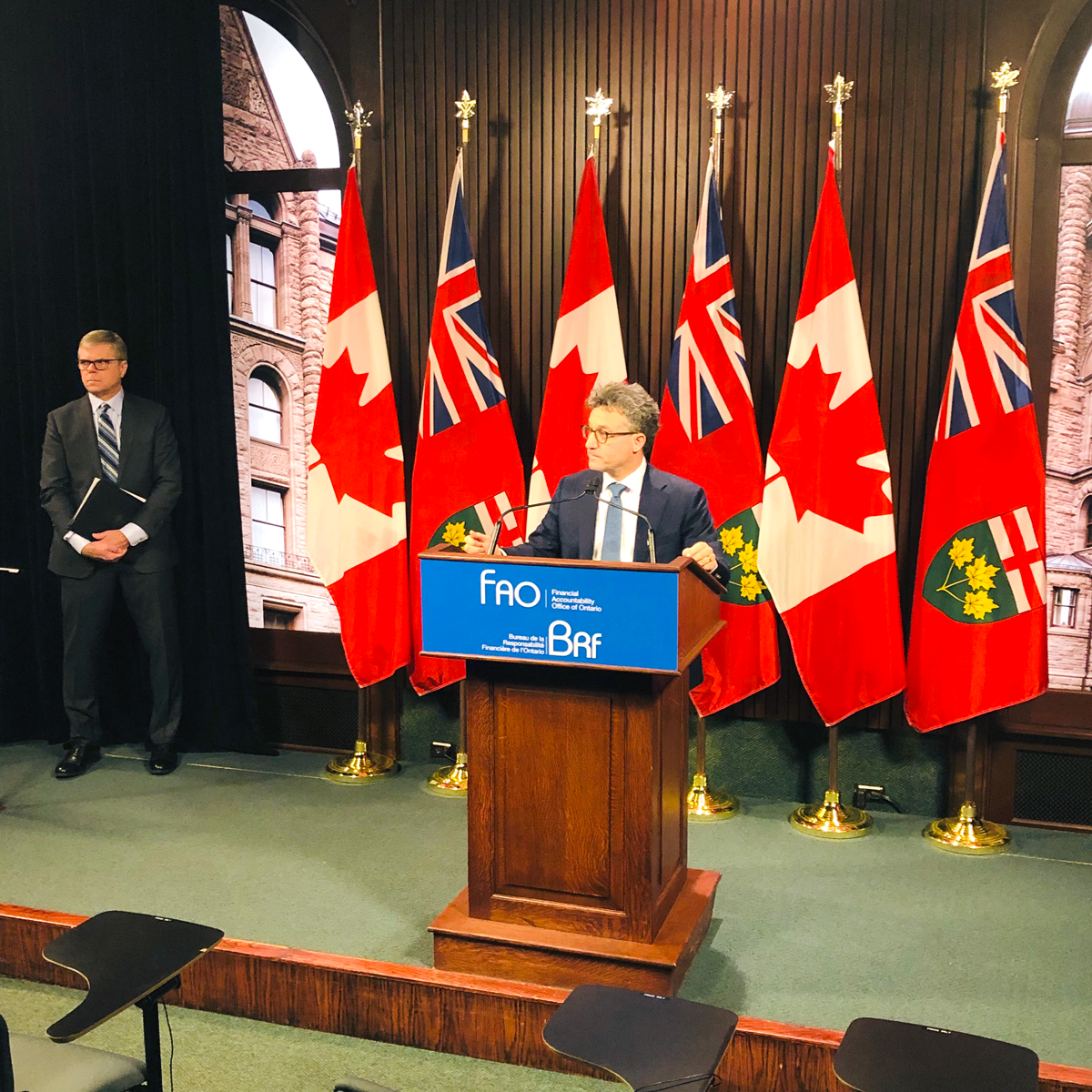 Peter Weltman and David West at the press conference for the Fall 2019 Economic and Budget Outlook.